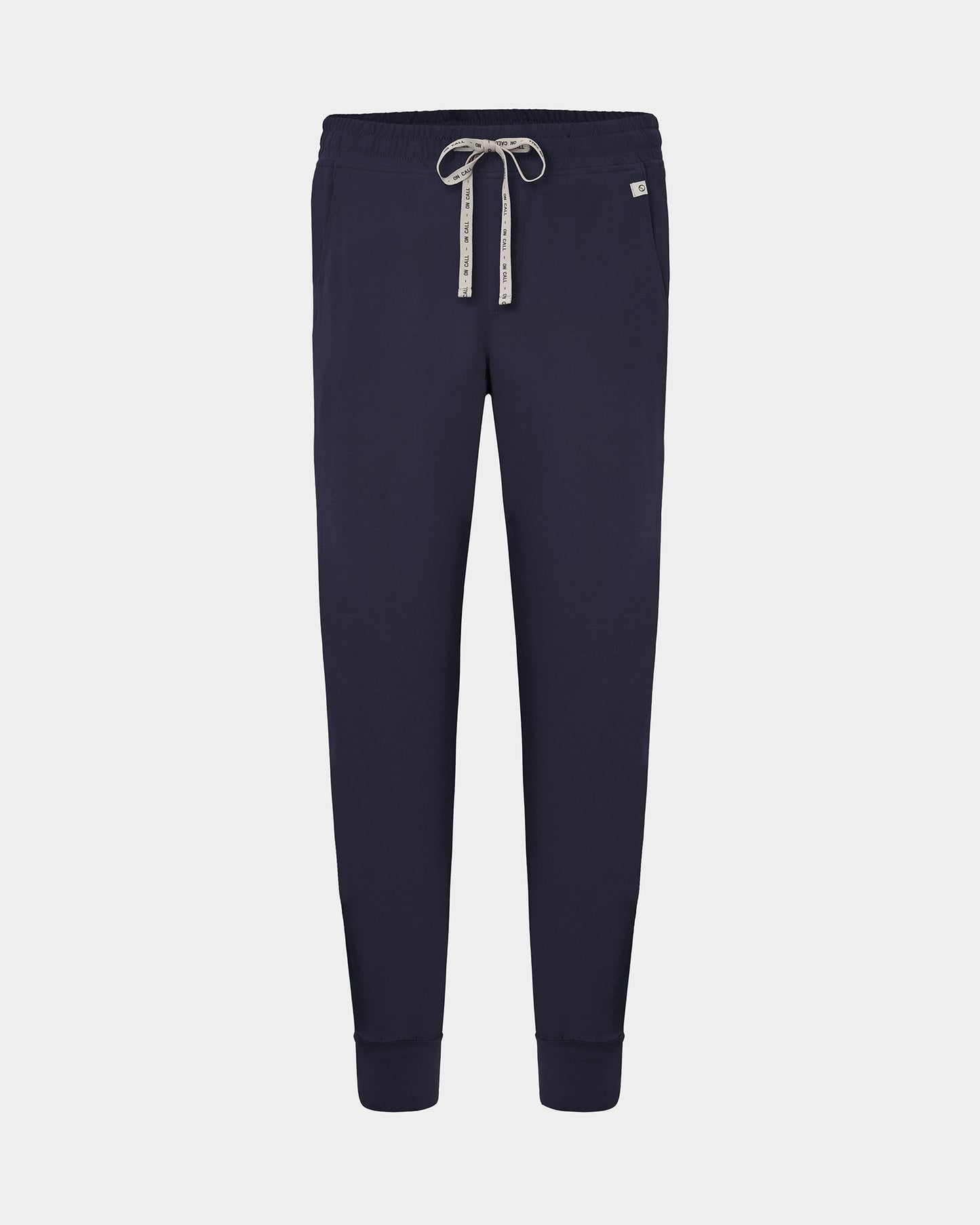 A pair of navy jogger pants with a logo drawstring, displayed on a light gray background.