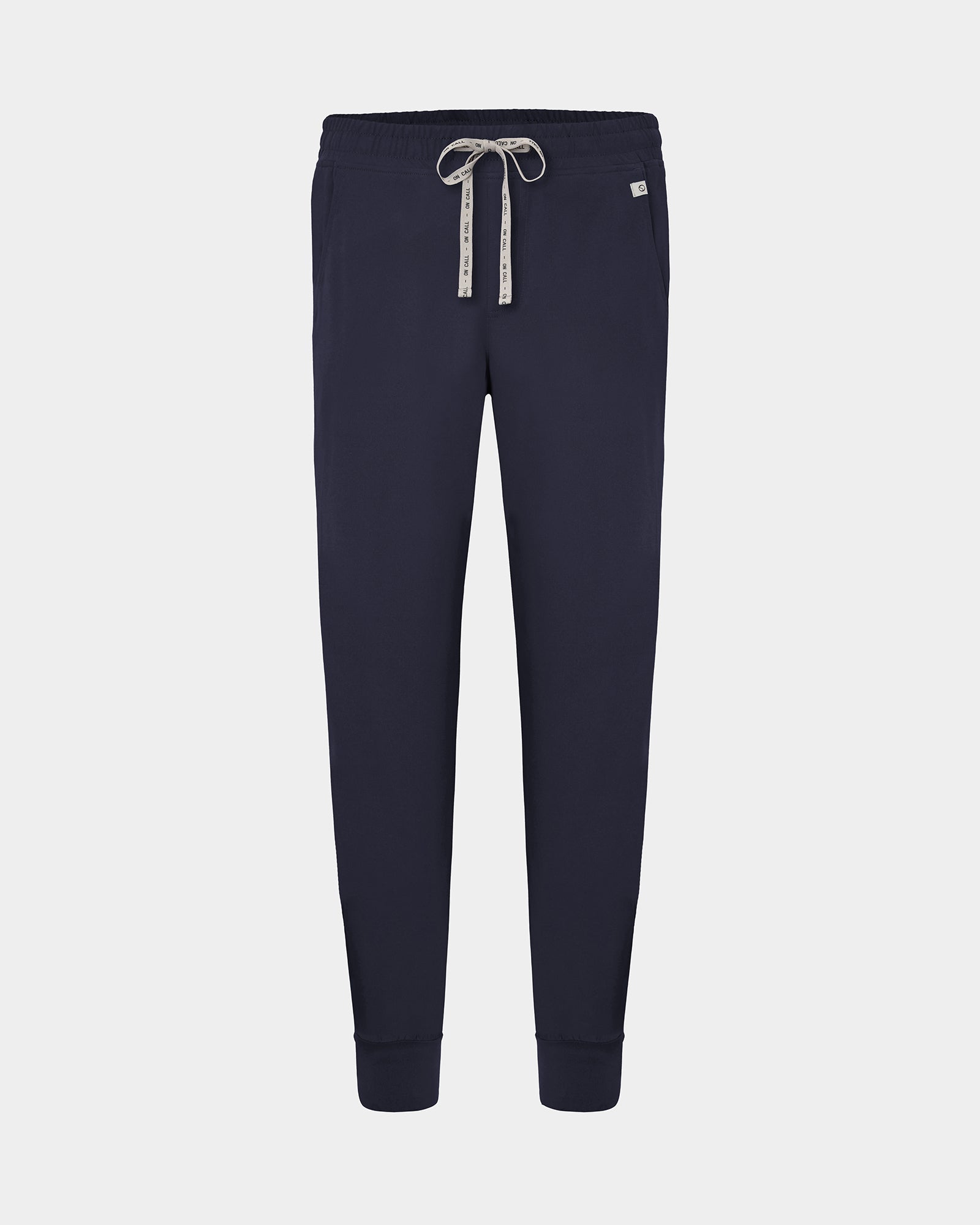 A pair of navy jogger pants with a logo drawstring, displayed on a light gray background.