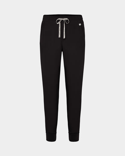 Black jogger scrub pants with a logo drawstring, ankle cuffs, and a small white logo on the left hip, shown against a light gray background.