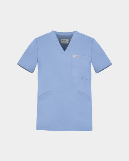 A light blue scrub top with a V-neck, short sleeves, a chest pocket, and two lower front pockets, shown on a light gray background.