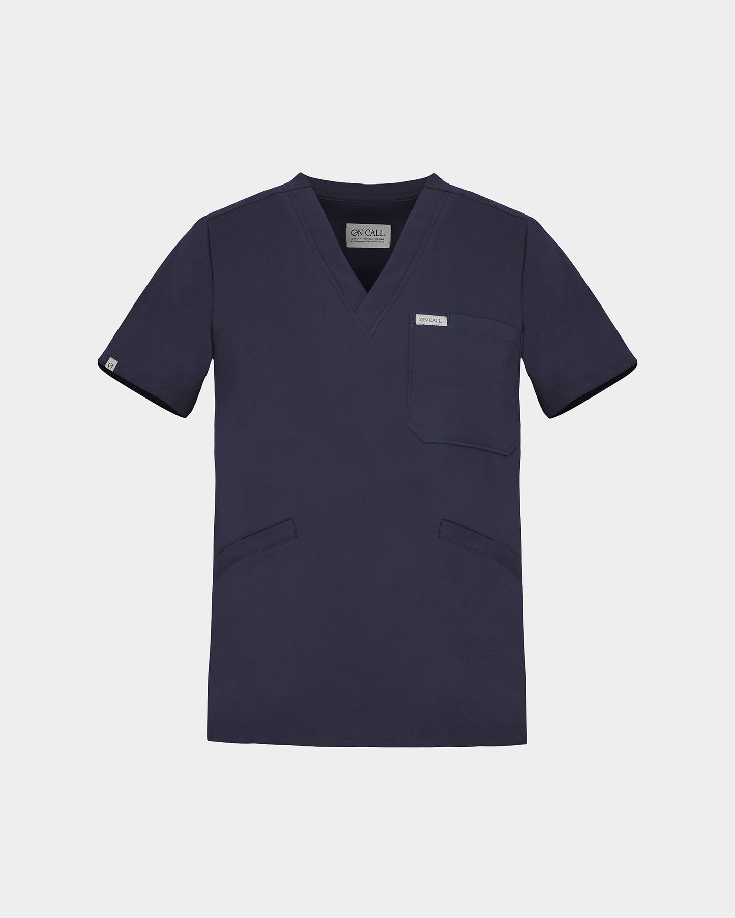 A v-neck navy scrub shirt with a chest pocket and two lower pockets on the front.