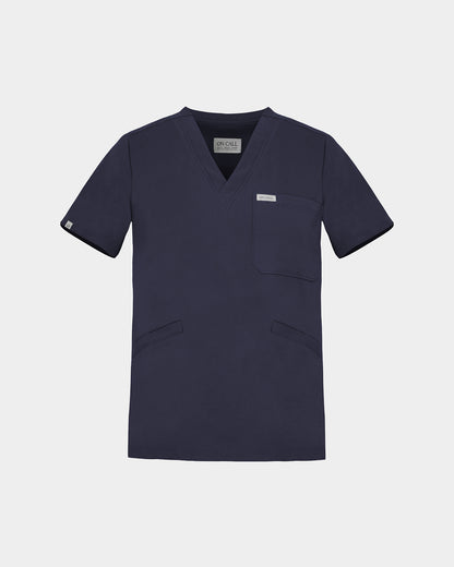 A v-neck navy scrub shirt with a chest pocket and two lower pockets on the front.