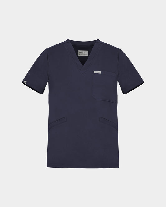 A v-neck navy scrub shirt with a chest pocket and two lower pockets on the front.
